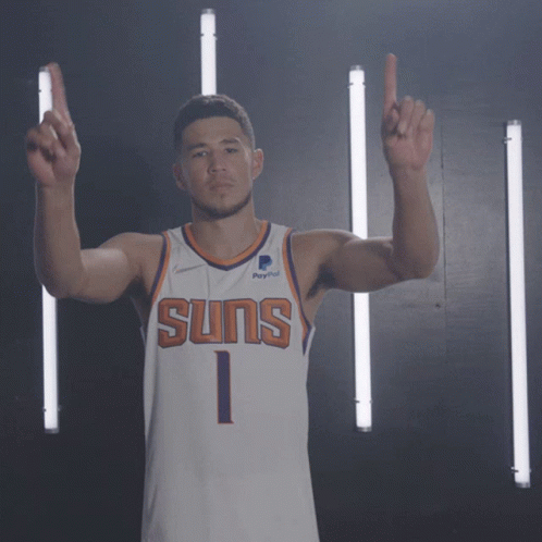 A Man Wearing A Suns Jersey With The Number 1 GIF