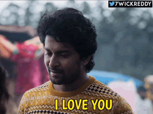 A Man Wearing A Sweater Says I Love You GIF