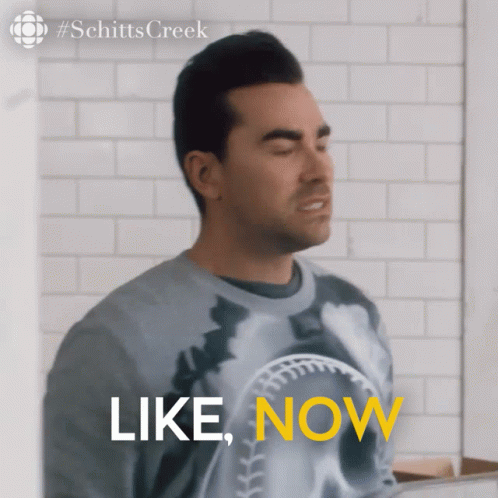 A Man Wearing A Sweater That Says " Like Now " GIF