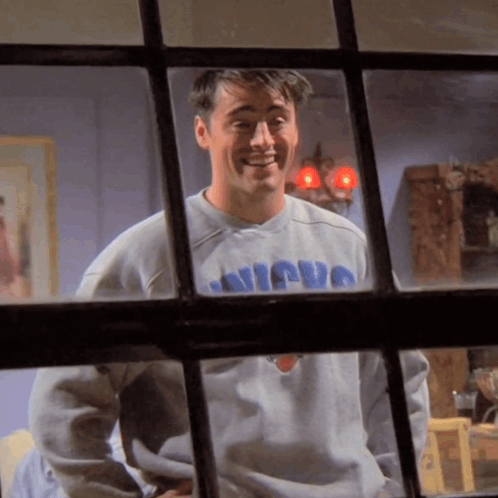 A Man Wearing A Sweater That Says Nicuo On It GIF