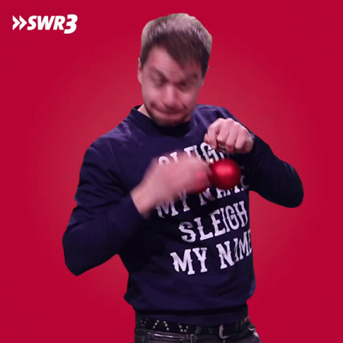 A Man Wearing A Sweater That Says " Sleigh My Name " GIF