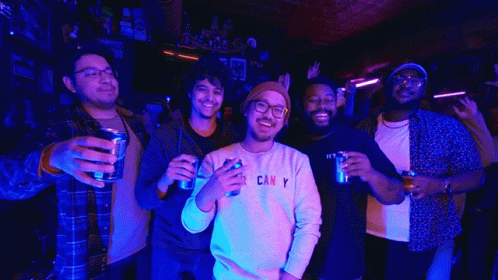 A Man Wearing A Sweatshirt That Says " Can Y " Holds A Can Of Beer GIF