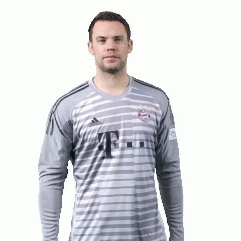 a man wearing a t-mobile jersey holds up his finger