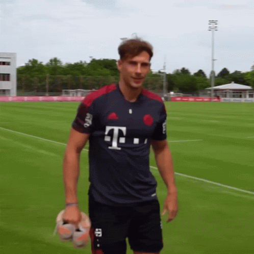 A Man Wearing A T-Mobile Jersey Stands On A Soccer Field GIF