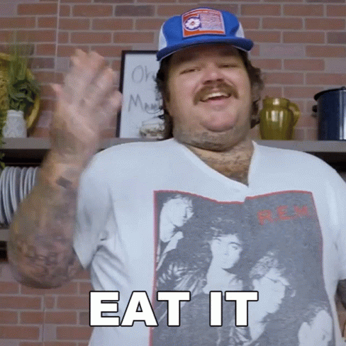 A Man Wearing A T-Shirt That Says " Eat It " GIF