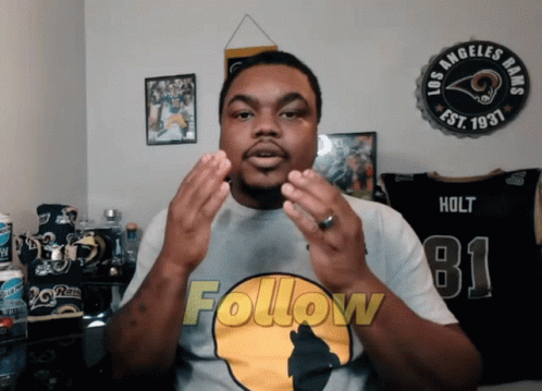 A Man Wearing A T-Shirt That Says Follow On It GIF