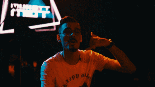 A Man Wearing A T-Shirt That Says ' Lipp Bitch ' On It GIF