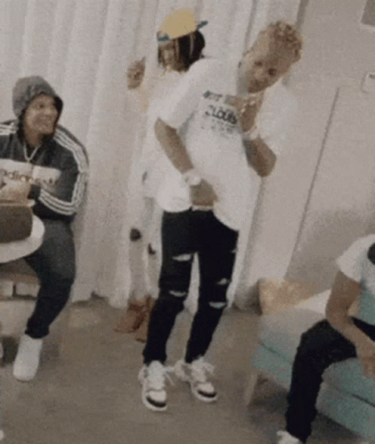 A Man Wearing A T-Shirt That Says Loud Is Dancing In A Room GIF