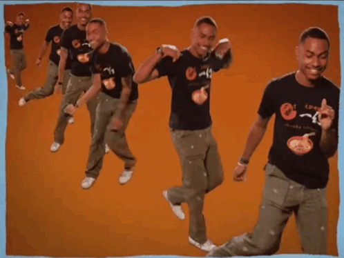 A Man Wearing A T-Shirt That Says ' Noodles ' On It Is Dancing GIF