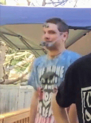 A Man Wearing A T-Shirt That Says The Name Of The Game Is Free GIF