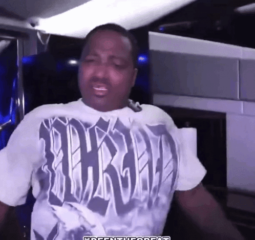 A Man Wearing A T-Shirt That Says Thrashed On It GIF