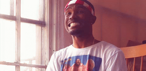 A Man Wearing A T-Shirt With A Picture Of Jesus On It Is Smiling GIF