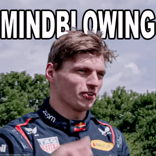 A Man Wearing A Tag Heuer Shirt Is Making A Funny Face GIF