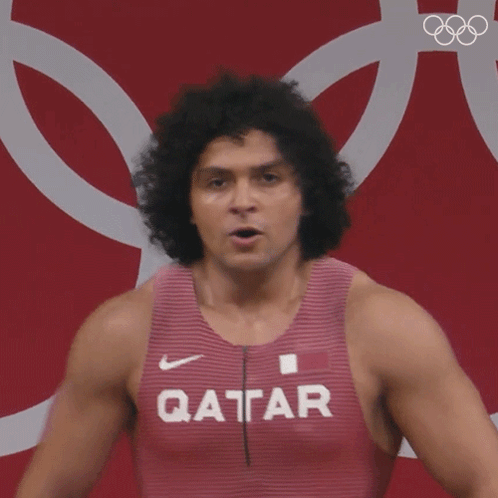 A Man Wearing A Tank Top That Says Qatar GIF