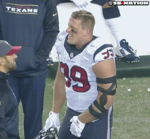 A Man Wearing A Texans Jersey With The Number 39 On It GIF