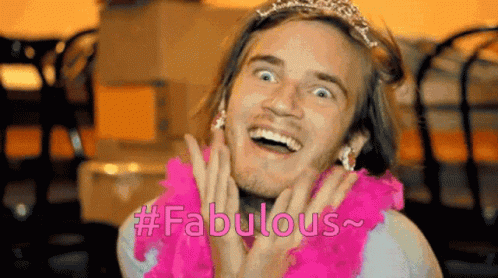 A Man Wearing A Tiara And A Pink Boa Has The Word Fabulous Written On His Face GIF