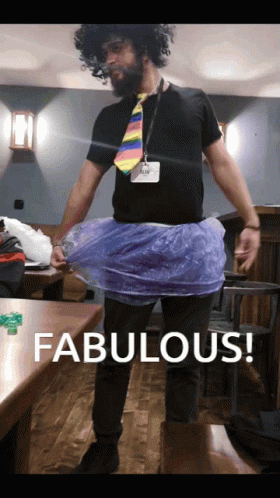 A Man Wearing A Tie And A Plastic Skirt Says Fabulous On The Bottom GIF