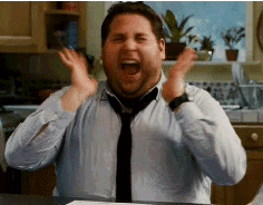 A Man Wearing A Tie And A Shirt Is Screaming In A Kitchen . GIF