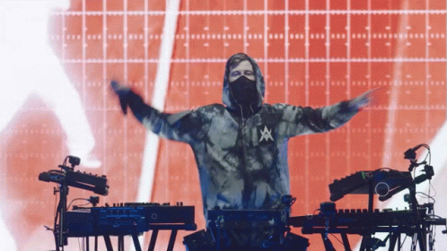 A Man Wearing A Tie Dye Hoodie With The Letter A On The Front GIF