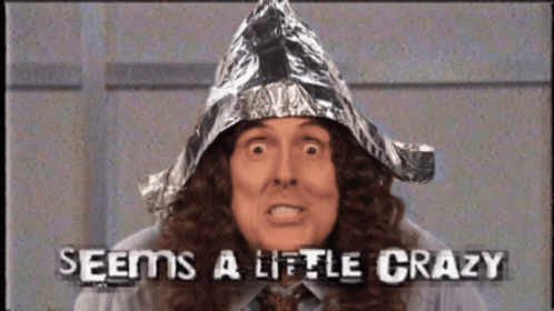 A Man Wearing A Tin Foil Hat With The Words Seems A Little Crazy GIF