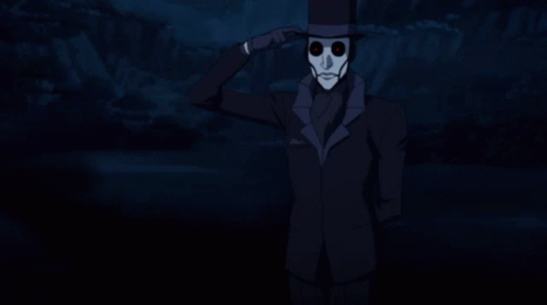 A Man Wearing A Top Hat And A Mask With Red Eyes GIF