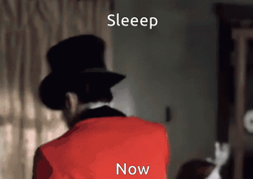 Man In Top Hat And Red Jacket Standing In Front Of Sleep Now Sign GIF