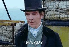 A Man Wearing A Top Hat And A Suit Is Standing In Front Of A Boat . GIF