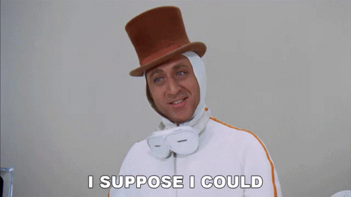 A Man Wearing A Top Hat And Goggles Is Saying I Suppose I Could GIF