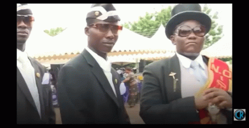 A Man Wearing A Top Hat And Sunglasses Is Standing Next To Another Man In A Suit GIF