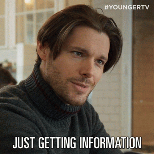 A Man Wearing A Turtleneck Sweater With The Words Just Getting Information Below Him GIF