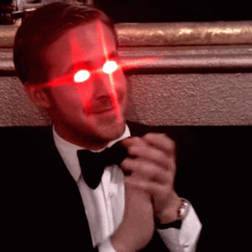 Man In Tuxedo With Red Eyes GIF