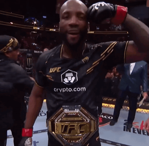 A Man Wearing A Ufc Shirt And A Ufc Championship Belt GIF