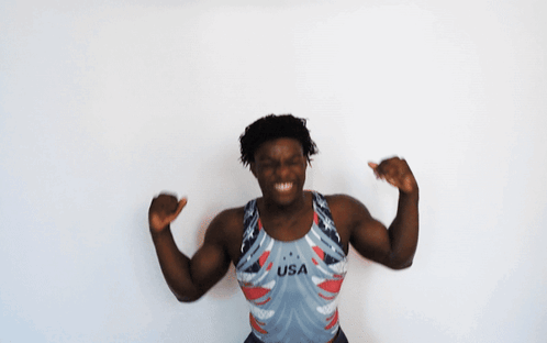 A Man Wearing A Usa Tank Top Is Dancing GIF