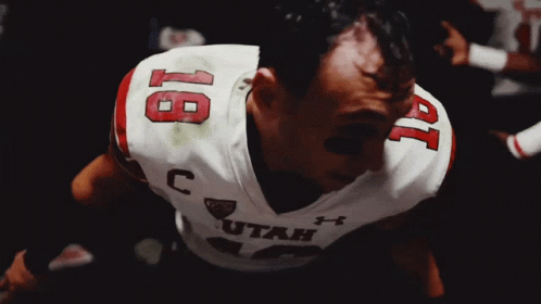 a man wearing a utah jersey with the number 19 on it