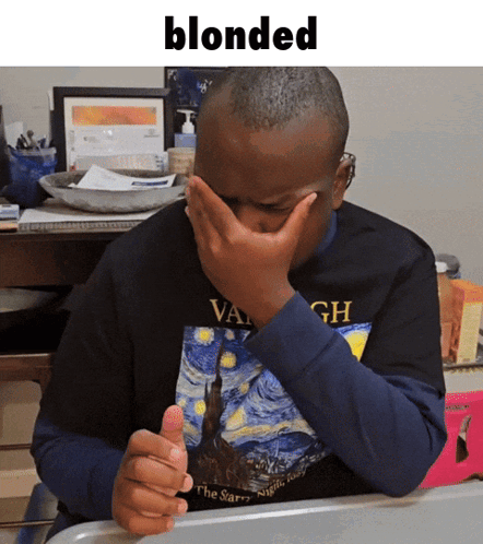 A Man Wearing A Van Gogh Shirt Is Covering His Face With His Hand GIF