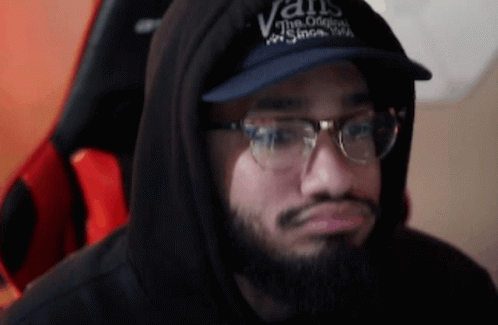 A Man Wearing A Vans Hat And Glasses GIF