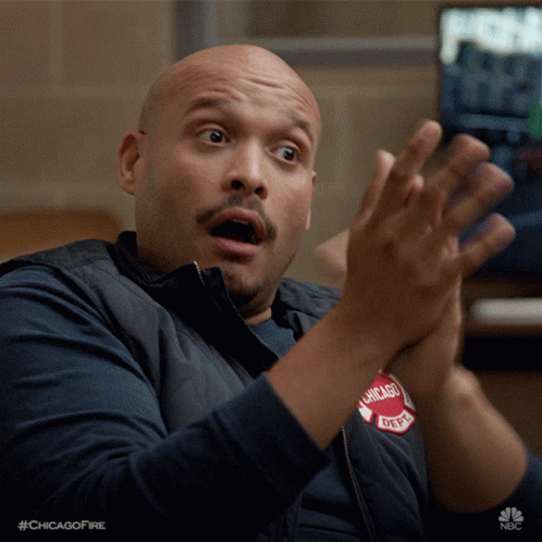 A Man Wearing A Vest That Says Chicago Fire On It GIF