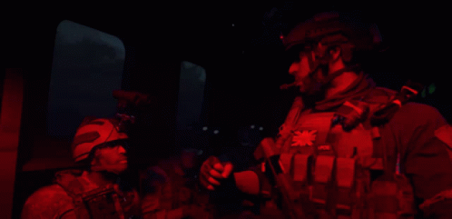 A Man Wearing A Vest That Says Pvb On It GIF