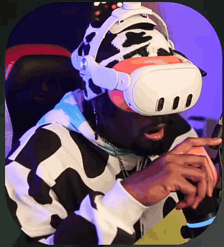 A Man Wearing A Virtual Reality Headset And A Cow Print Hat GIF