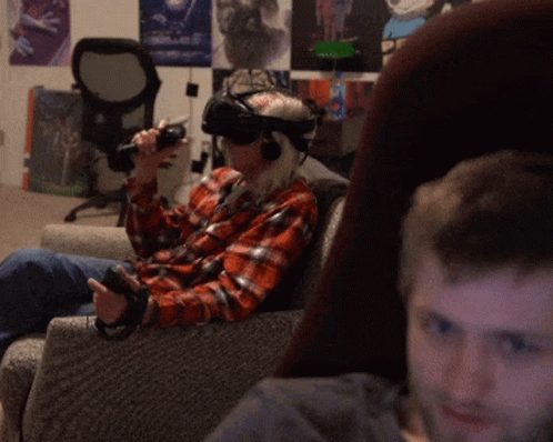 Man Wearing VR Headset Sitting On Chair GIF