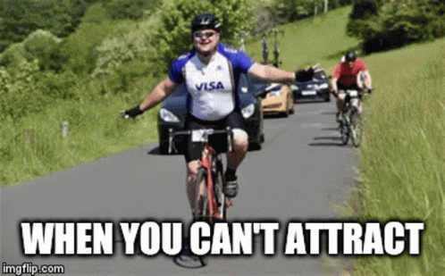 A Man Wearing A Visa Shirt Is Riding A Bike On A Road GIF