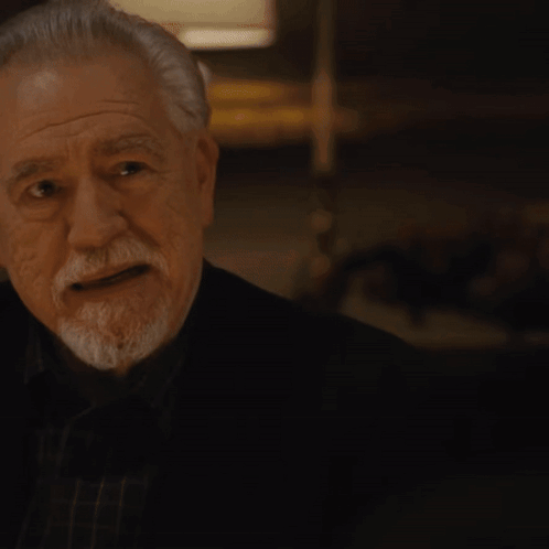 A Man Wearing A Watch Looks At Something GIF