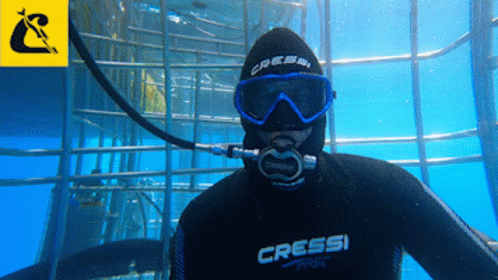 A Man Wearing A Wetsuit That Says Cressi On The Front GIF