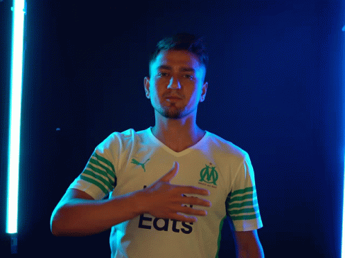 A Man Wearing A White And Green Shirt That Says Eats GIF