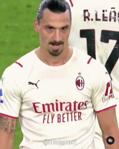 A Man Wearing A White Emirates Fly Better Shirt GIF