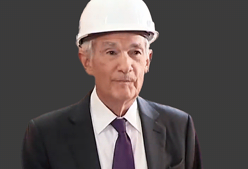 A Man Wearing A White Hard Hat And A Suit GIF