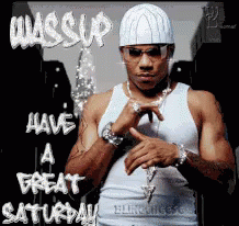 A Man Wearing A White Hat And Sunglasses Is Standing In Front Of A Sign That Says Have A Great Saturday GIF