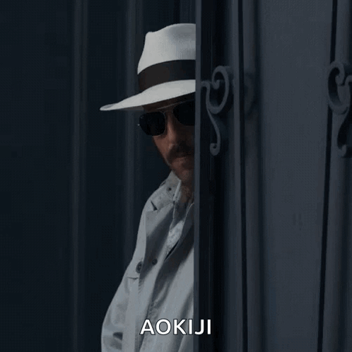 a man wearing a white hat and sunglasses says aokaji
