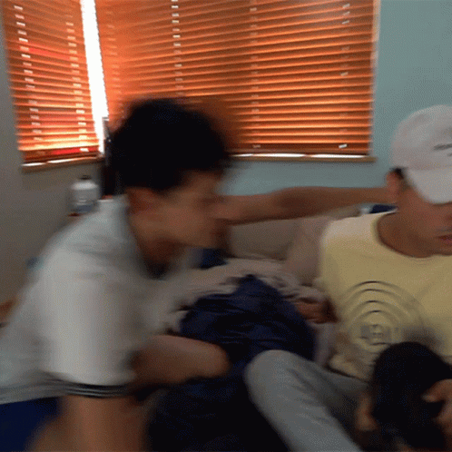 A Man Wearing A White Hat That Says ' Reebok ' On It GIF