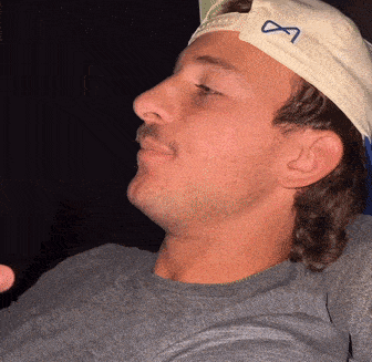 A Man Wearing A White Hat With An Infinity Symbol GIF